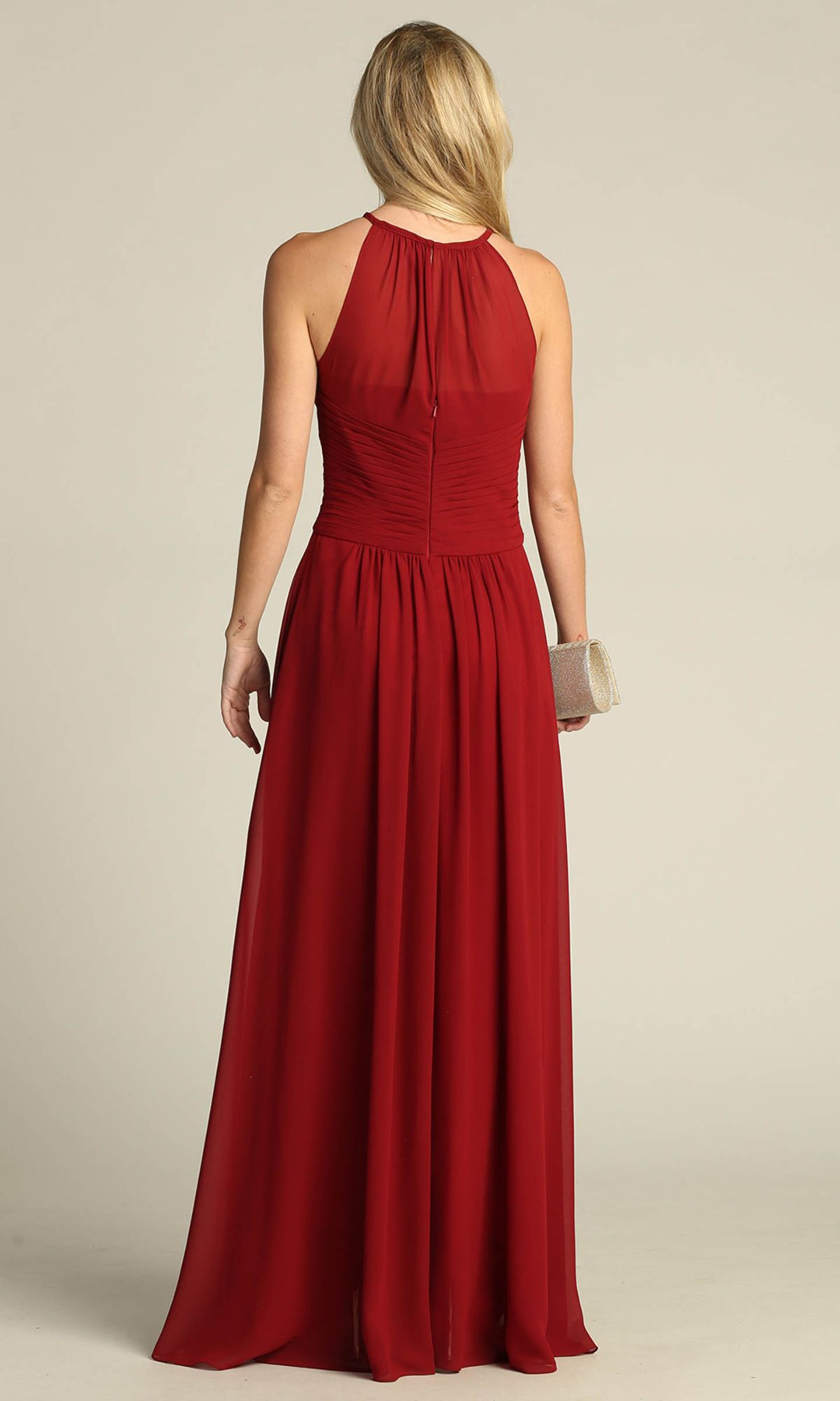 A woman with long blonde hair wears the Chicas C5150 High-Neck Long A-Line Prom Dress in red, holding a small beige clutch and standing with her back to the camera against a plain background.
